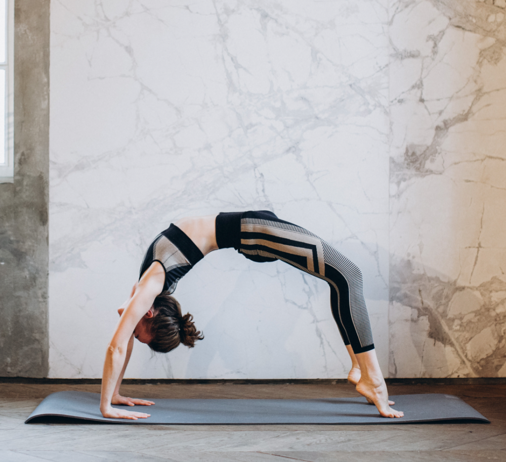 woman doing yoga bridge pose