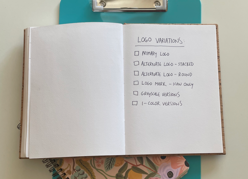 Notebook open with checklist of the logo variations you need