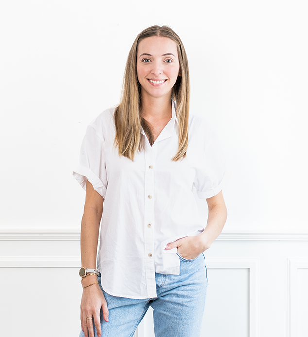 Virtual Assistant Roxy standing in front of a white wall